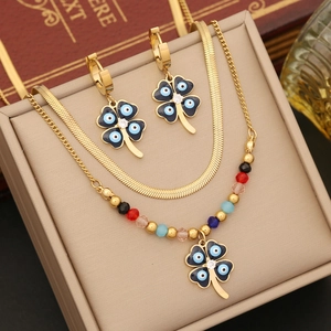 Gold stainless steel evil eye jewelry set with layered necklace and clover earrings