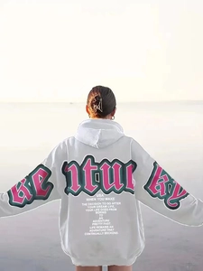 Back view of light grey oversized hoodie featuring Adventure graphic print and artistic text