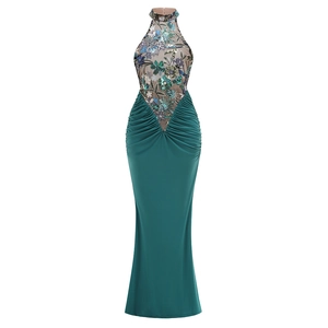 Detail of dark green halter dress featuring embroidered mesh sequins and pleated skirt