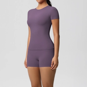 Detail view of skin-friendly high-stretch yoga set with slim fit t-shirt and gym shorts