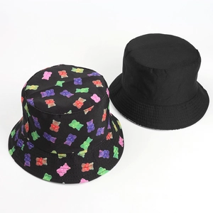 Reversible bucket hat for women featuring cute colorful cartoon bear prints on black cotton