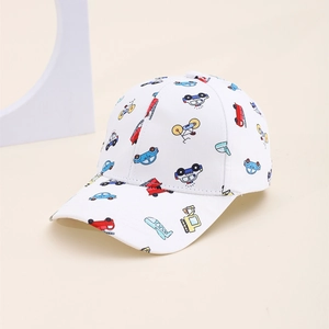 Detail of kids baseball cap with cartoon vehicle prints on white twill fabric
