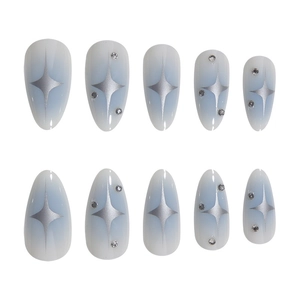 Blue gradient almond press-on nails set with silver stars and tiny rhinestones
