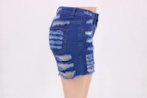 Detailed side view of high-waist blue denim shorts with distressed ripped hem details