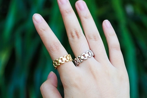Punk style watch band link rings in gold and silver finish shown on hands