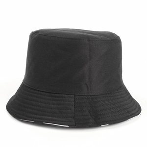 Detail of a black cotton bucket hat showing parallel stitching on the reinforced brim