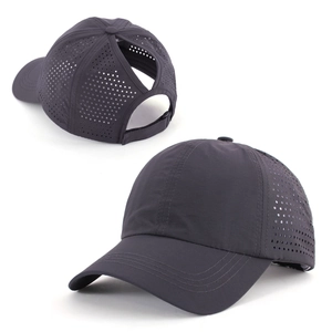 Detail view of dark grey quick-dry baseball cap with laser-cut holes and ponytail hole