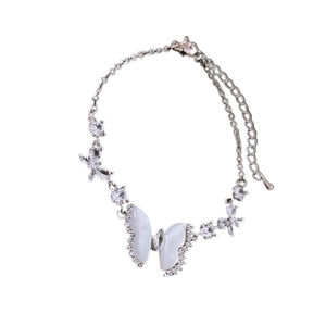 Elegant silver butterfly bracelet with cubic zirconia and shell texture accents for women