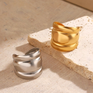 Minimalist 18K gold and silver chunky wave rings with a matte textured metal finish