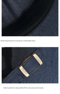 Detail of dark blue denim hat showing breathable sweatband and adjustable brass metal buckle