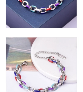 Macro shot of colorful enamel link bracelet with S.steel engraving and lobster clasp