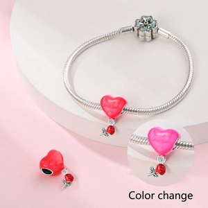 Color-changing heart pendant with rose charm on a clover clasp snake chain bracelet