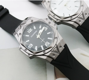 Macro view of black and white quartz watches with large dials and silicone straps
