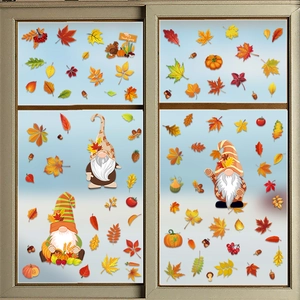 Detail of Thanksgiving window static clings featuring maple leaves, gnomes and pumpkins