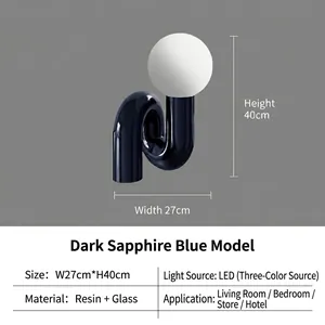 Modern deep blue wavy resin table lamp with spherical glass shade and LED lighting