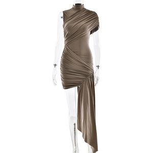 Detail of slim fit asymmetrical dress with pleated texture and side ribbons
