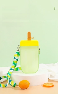 Detail of popsicle shaped water bottle with light green frosted texture and carry strap