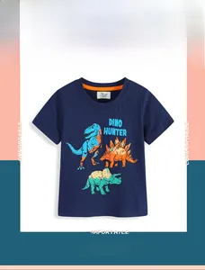 Close-up of Dino Hunter dinosaur prints and cotton texture on navy blue kids t-shirt