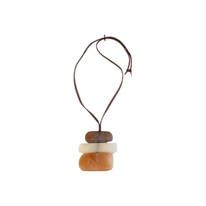 Minimalist necklace with stacked irregular marble texture stones on a brown cord string