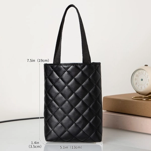 Close-up of black quilted tote bag with dimensions 19cm height and 13cm width