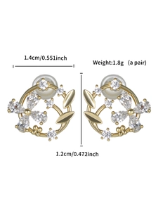 Detail view of gold flower earrings with white zircon stones and 1.4cm width dimensions