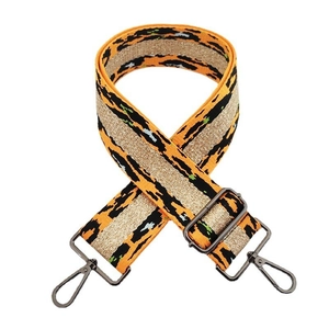 Close-up of leopard print bag strap with golden thread and dark metal swivel hooks