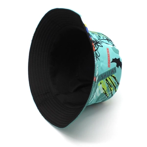 Detail showing the graffiti bucket hat with blue street style prints and black lining