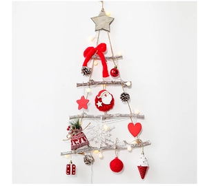 Detail of wooden wall-mounted Christmas tree with festive ornaments and LED string lights