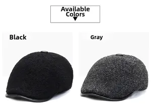Detail view of winter flat caps in black and grey with wool texture and leather brims