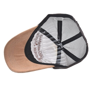 Close-up of trucker hat interior showing breathable mesh, sweatband, and care label