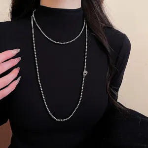 French vintage multi-layer pearl beaded sweater necklace with toggle clasp on model
