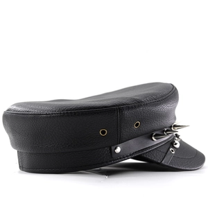 Detail of black leather punk military hat with silver spikes and metal rivets decor