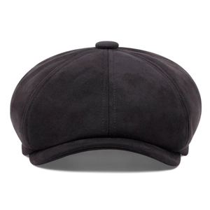 Macro detail of high-quality stitching and felt texture on black newsboy flat cap