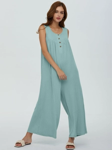 Detail of light blue sleeveless wide-leg jumpsuit with ribbed texture and front buttons