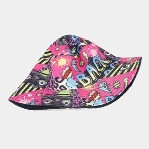 Detailed view of the vibrant graffiti pop art prints on the cotton bucket hat fabric