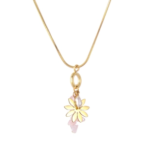Detail of gold snake chain with pink natural stone and white pearl flower pendant