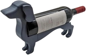 Macro detail of dark grey dachshund shaped wine holder with smooth plastic texture