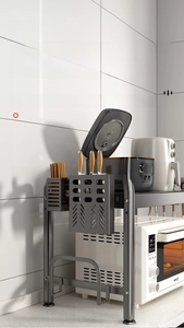 Detail of modular black kitchen rack with detachable knife holder and utensil hooks