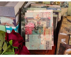 Macro shot of 100pcs vintage decorative scrapbook paper with red roses and old books