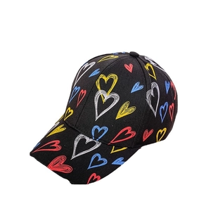 Trendy black baseball cap with colorful heart prints and wide brim for casual fashion