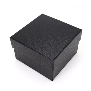 Square black faux leather watch gift box with lychee pattern texture on white background