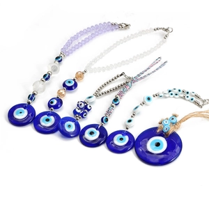 Detailed view of evil eye keychains with glass beads and woven cord pendant accessories