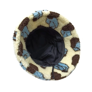 Detail view of lambswool bucket hat showing inner black lining and adjustable drawstring