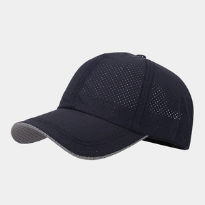 Detail of breathable laser-cut mesh on navy quick-dry sports baseball cap for summer