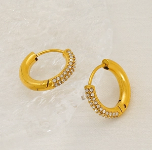Detail of 18K gold-plated titanium steel hoop earrings with micro-pave clear zircons