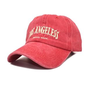 Detail of red washed cotton baseball cap with Los Angeles vintage embroidery