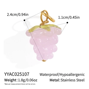 Detail view of a pink grape pendant in stainless steel with 18K gold finish