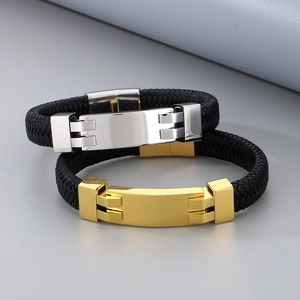 Close-up of polished stainless steel clasps on black braided leather men's bracelets