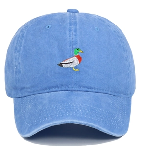Detailed close-up of green mallard duck embroidery on a navy washed cotton baseball cap