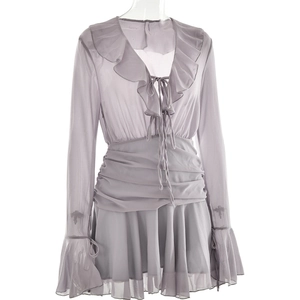 Detail of grey chiffon V-neck dress with ruffle edges, drawstring, and flared sleeves